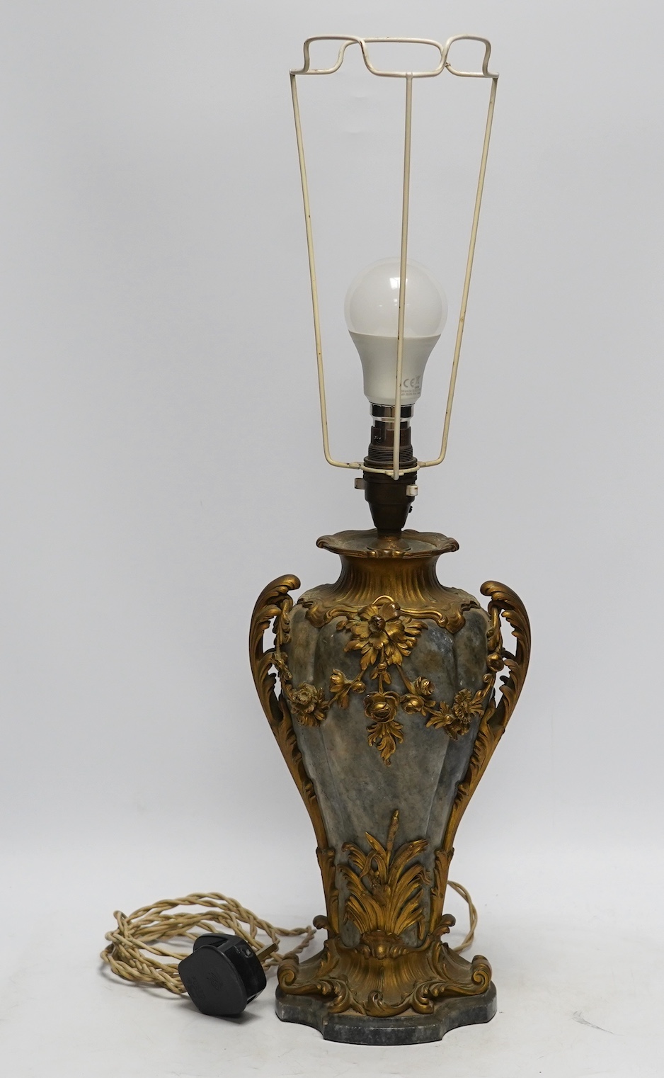 A 19th century French rococo style ormolu mounted grey marble lamp, converted to electricity, 29cm excluding light fittings